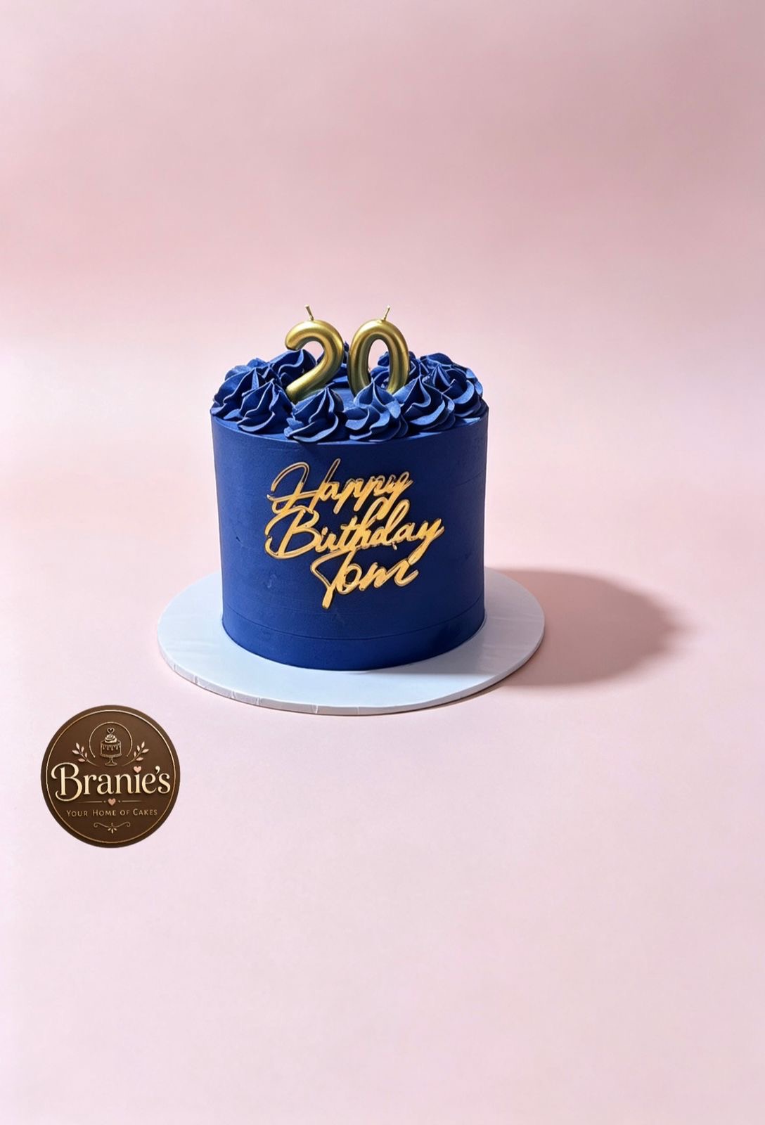 Navy blue birthday cake with gold lettering