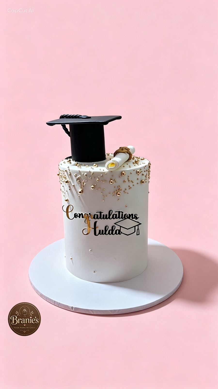 Elegant gold graduation cake by Branie's Bakery